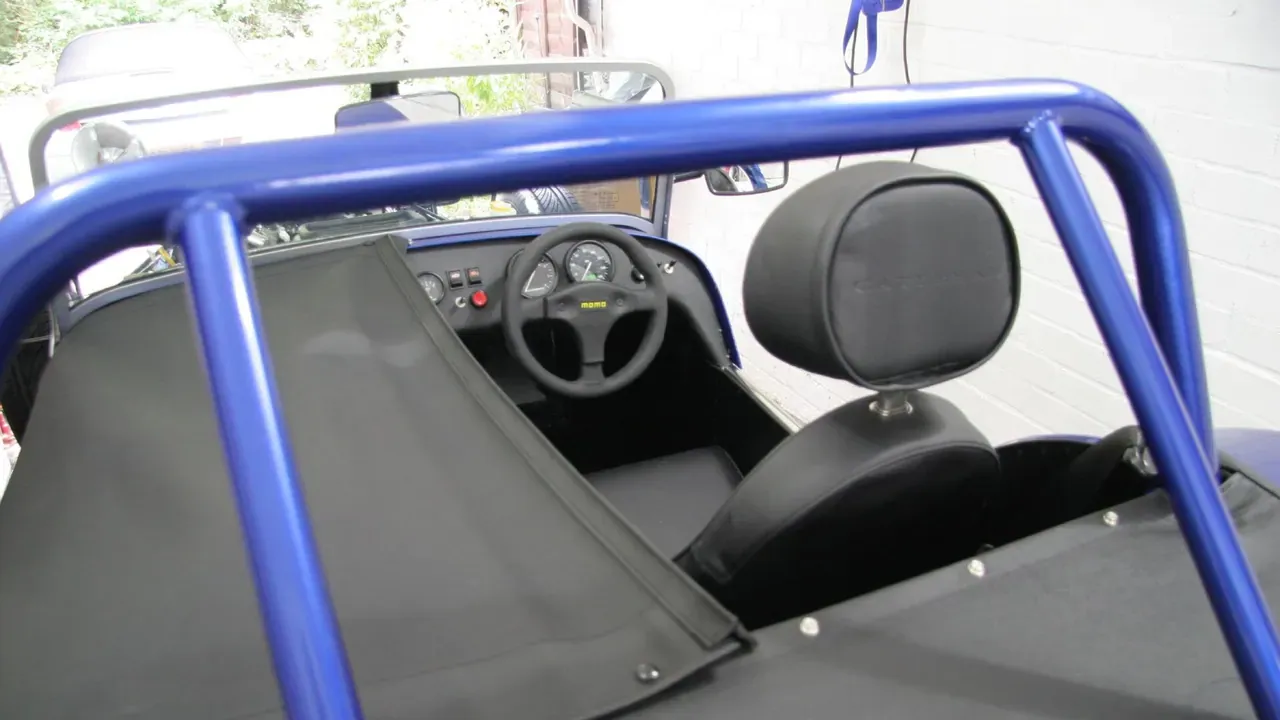 The seats and dashboard of an open-top sports car