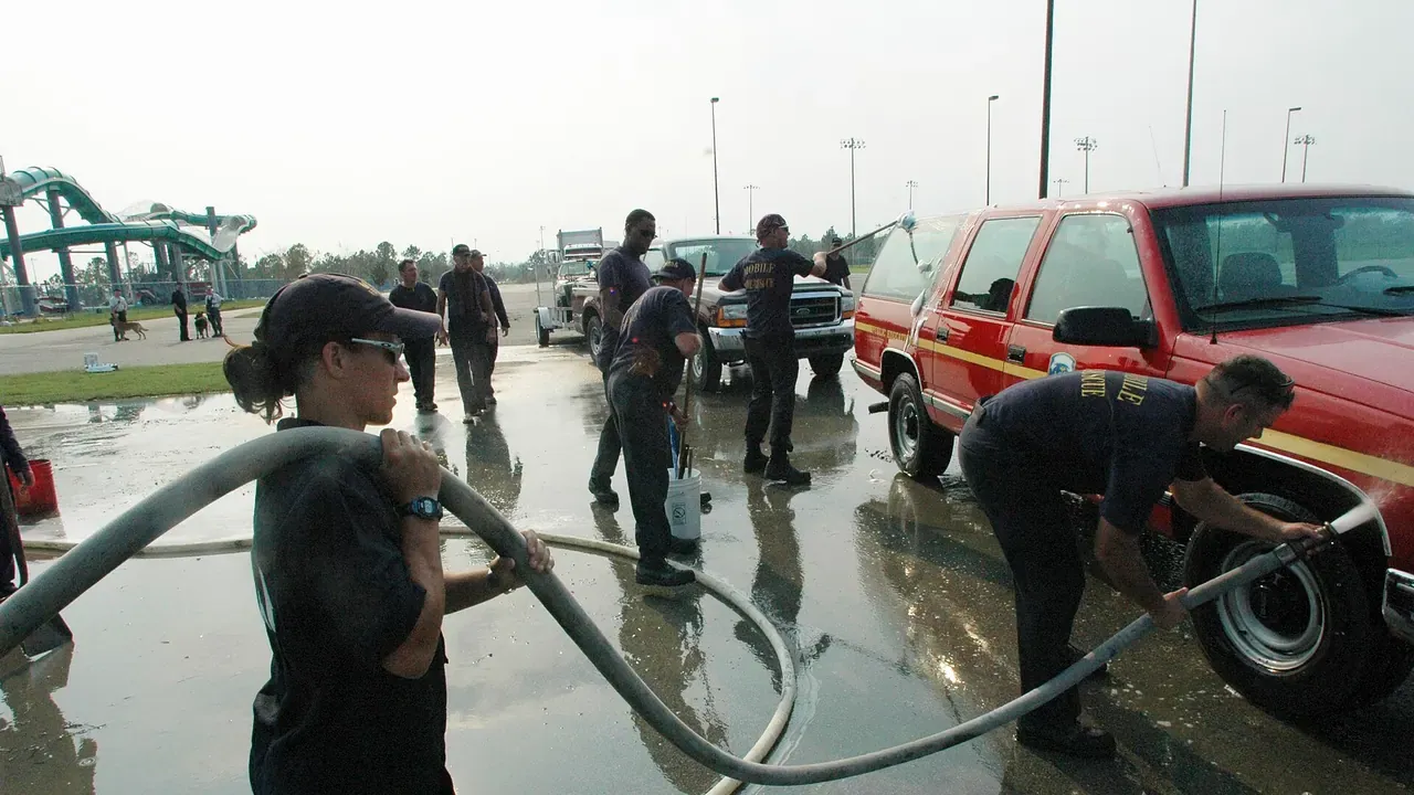 Emergency vehicles being decontaminated at an outdoor wash station