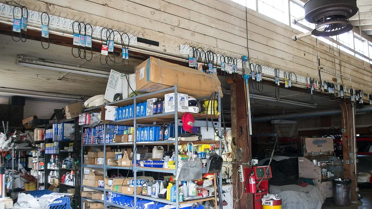 Shelves stocked with tools and supplies in an automotive shop